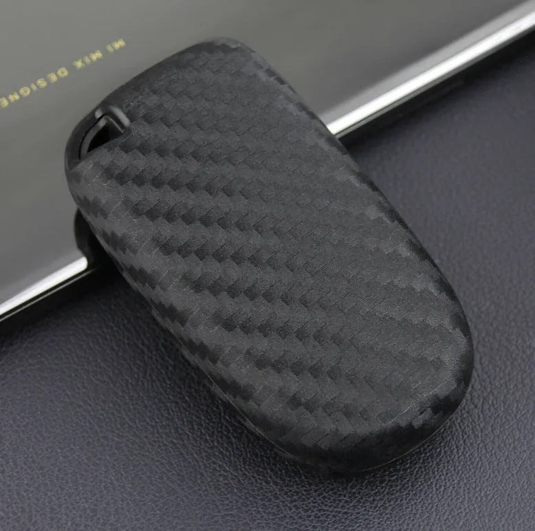 Carbon fibre pattern silicone protective case covering a Dodge, Chrysler, and Fiat car key fob