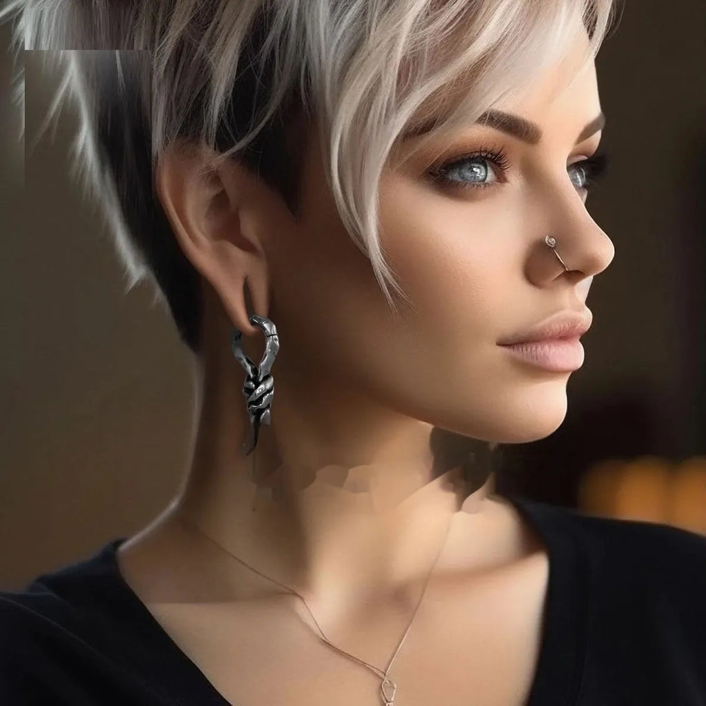 Close-up of Creative Bends And Hitches copper cartilage earrings with a 4mm gauge and retro bending design.