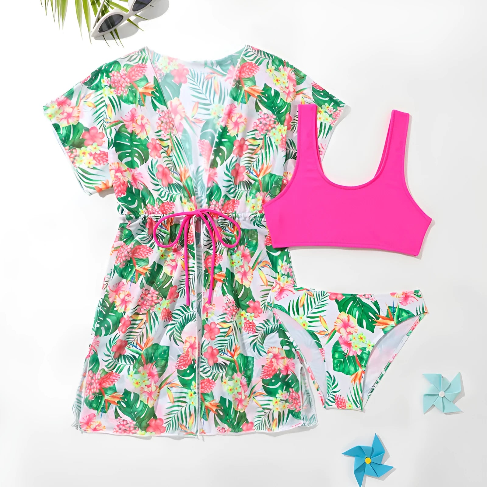 Girls' floral two-piece swimsuit in polyester on a white background, showing briefs style.