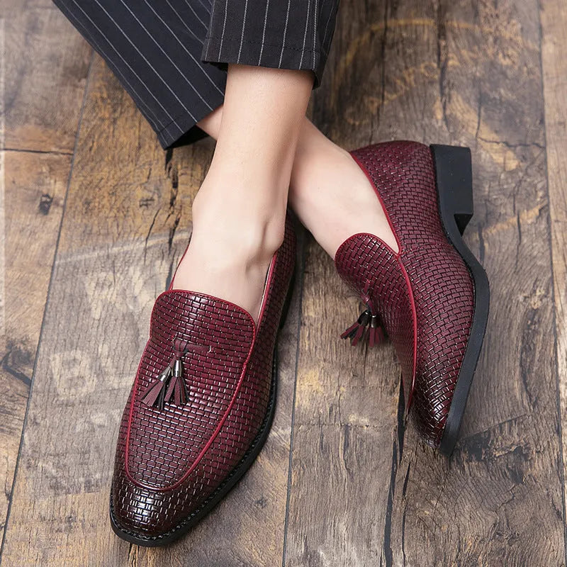Men's black pointed toe slip on shoes with a tassel detail, made from artificial PU material for business wear.