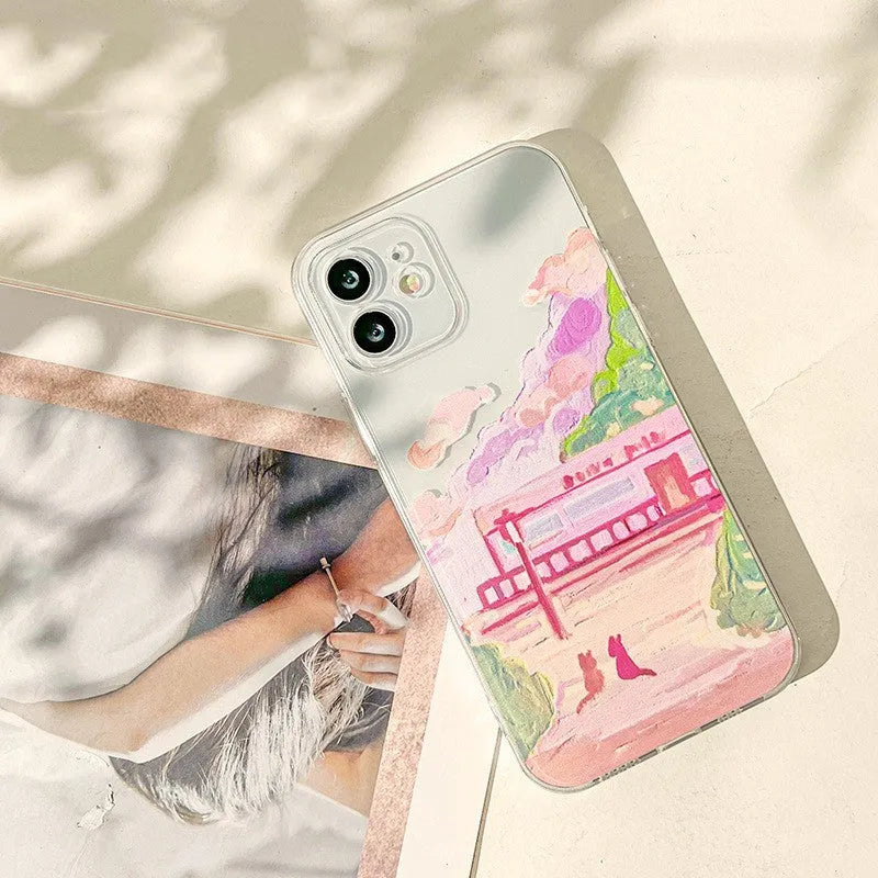 Soft silicone iPhone case with a two cat cartoon design on the back.