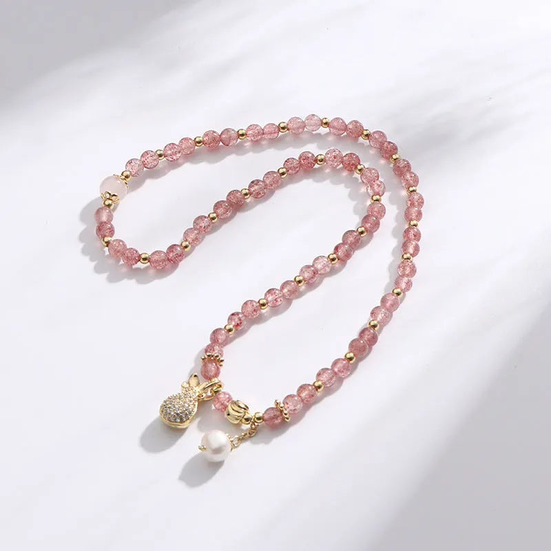 Women's strawberry quartz crystal bracelet with geometric shapes for money drawing