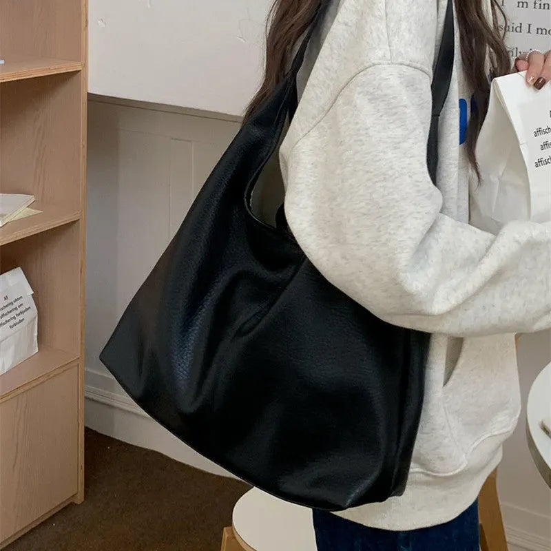 PU leather casual armpit bag for women, high capacity tote in black solid colour