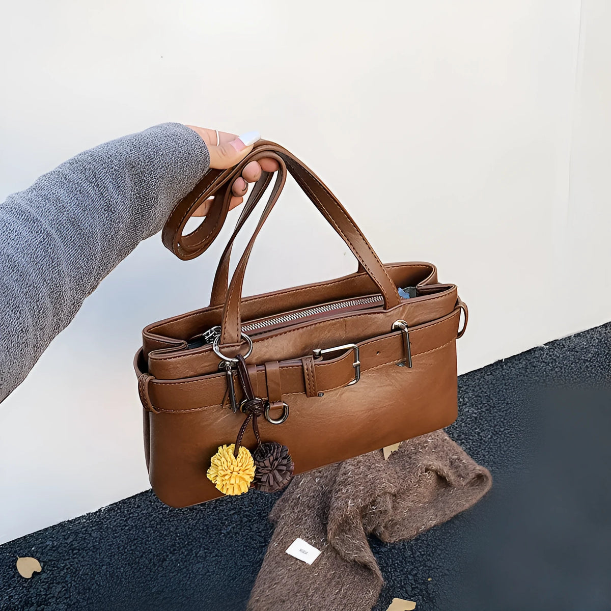 Women's retro belt buckle shoulder bag in PU, horizontal square shape, black or brown, with splicing detail.