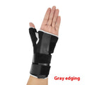Black carbon fibre wrist guard with grey edging and an adjustable thumb strap