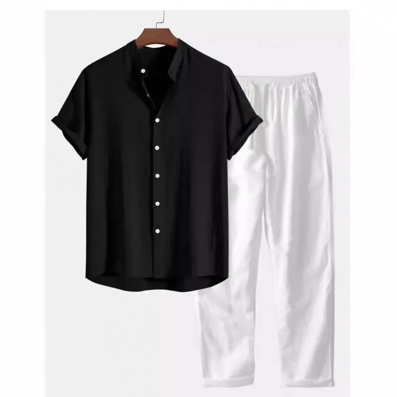 Man wearing a loose-fit short sleeve shirt and matching trousers from a casual linen-look polyester suit.