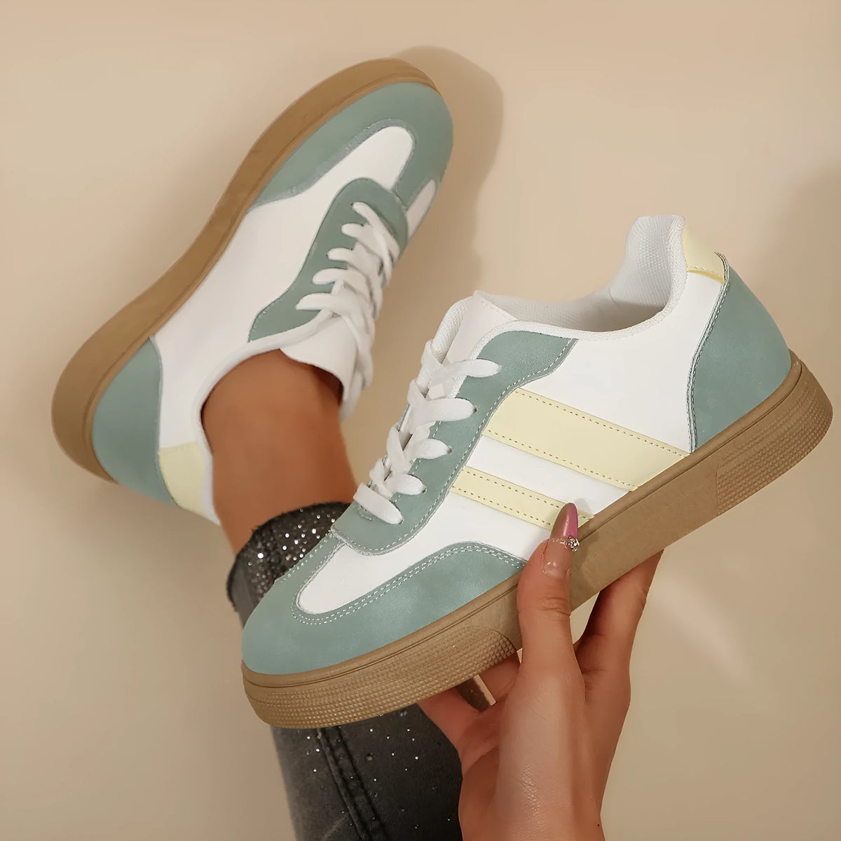 Women's green retro casual trainers with cross straps and round toe design on rubber sole