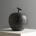 Resin apple sculpture in black, 17cm tall, smooth resin finish