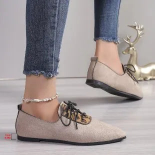 Beige leopard print women's pointed toe pumps with a rubber sole, shown in an extended size range.