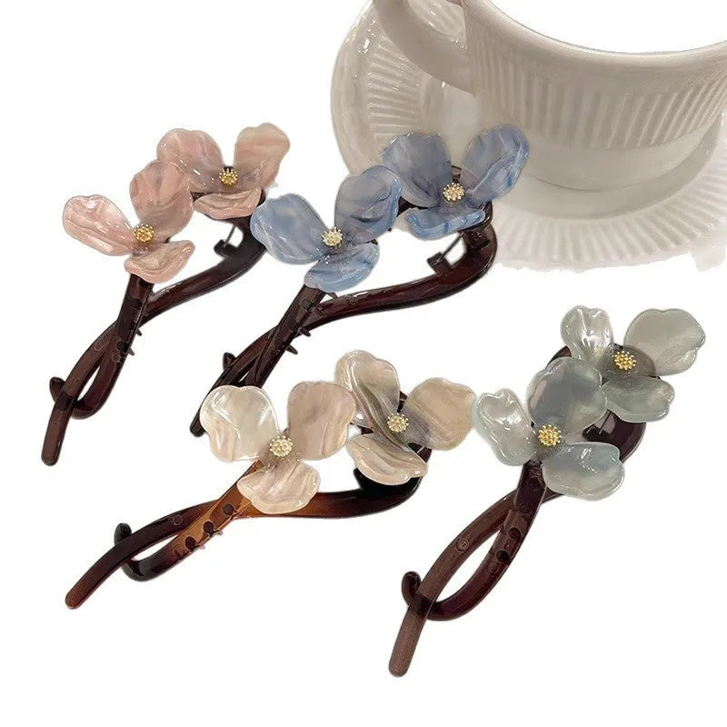 Retro flower bobby pin with acrylic petals for back head updos, available in blue, light blue, beige, or pink petals.