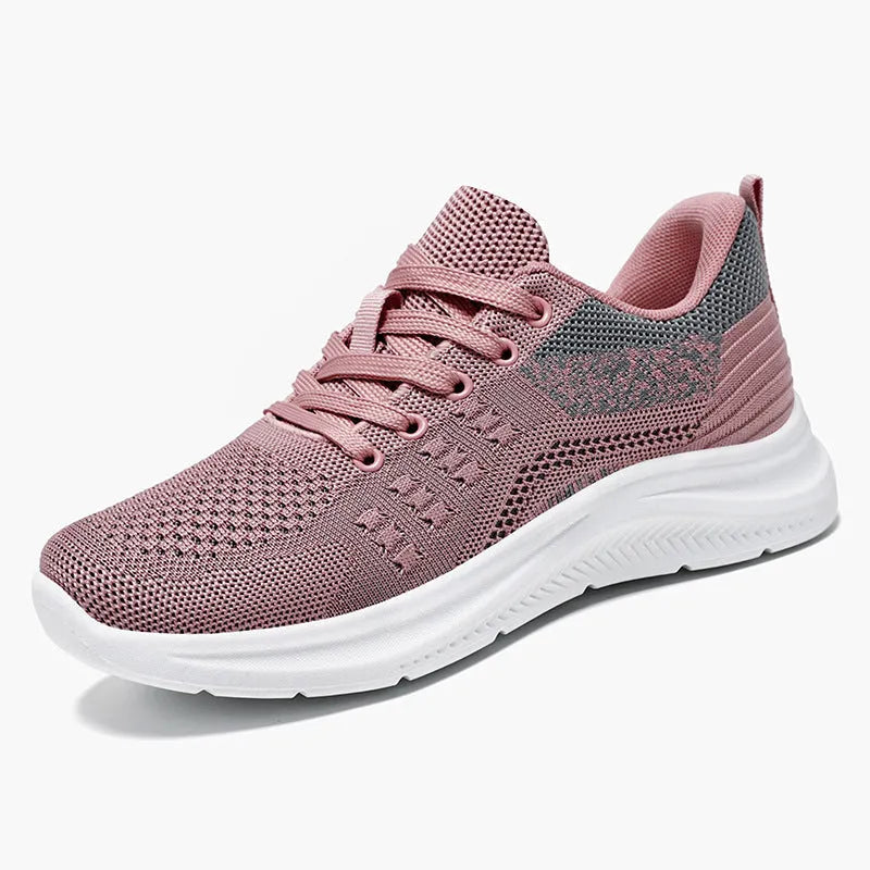 Women's low-top black mesh sneakers with lace-up front and round toe on a soft PVC sole.