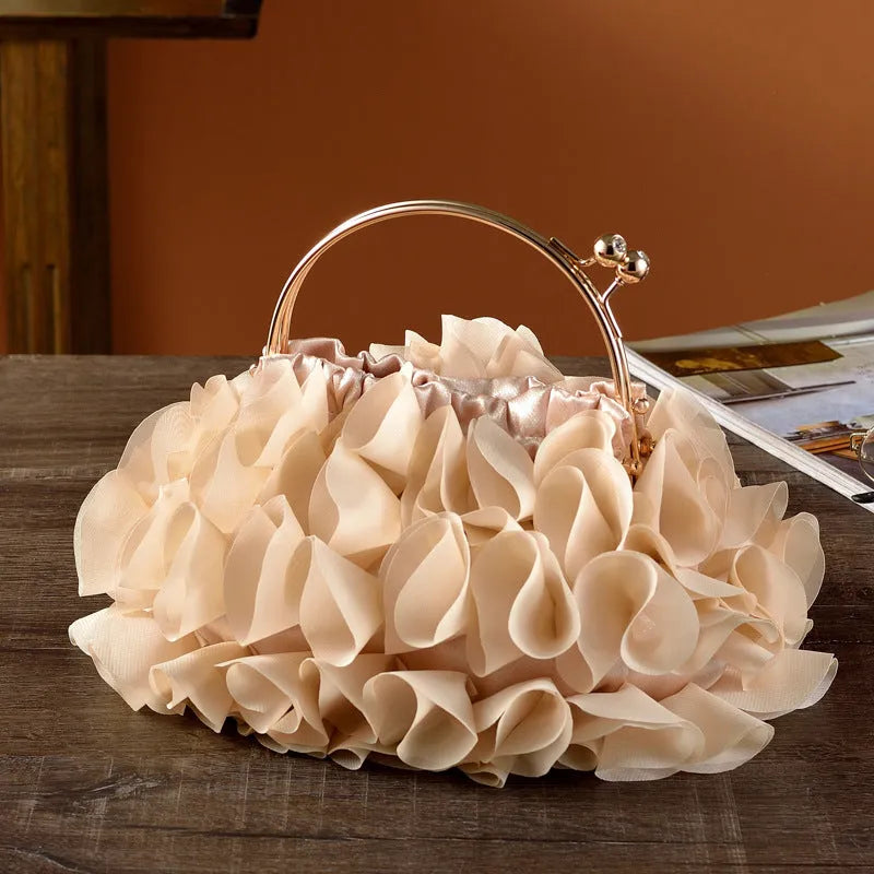 Handheld ladies' polyester banquet bag in soft dumpling shape with flower detail, black colour