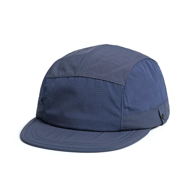 Breathable dome crown sun cap with a soft front tongue in Army Green colour on a wooden background.