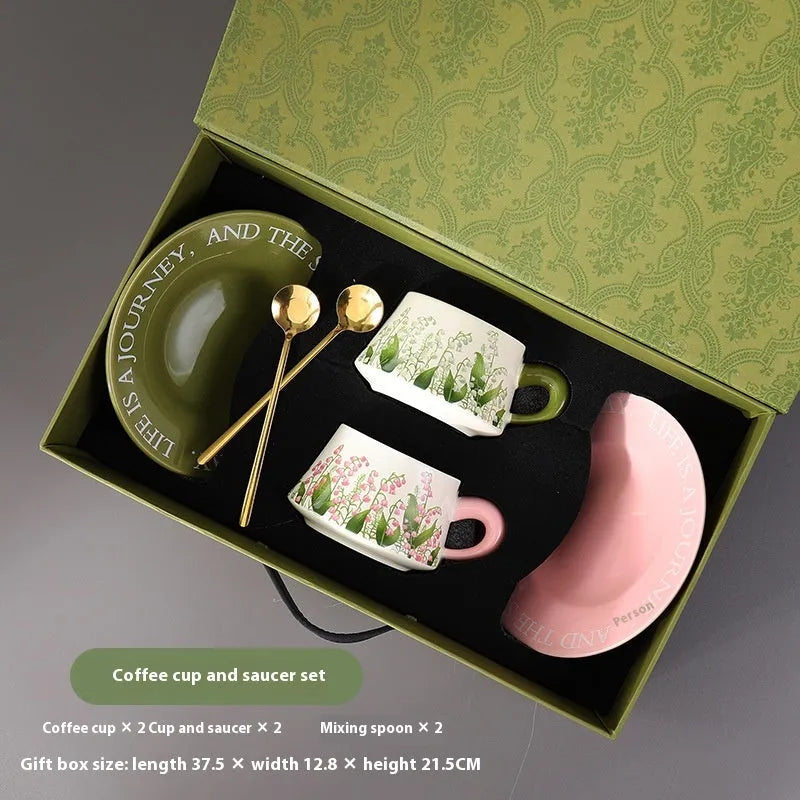 Ceramic coffee cup set with two 300ml cups, matching saucers, and stirring spoons