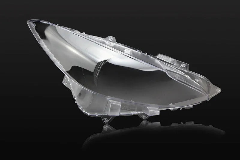 Mazda 3 Exela replacement headlamp cover with snake glue adhesive tube.