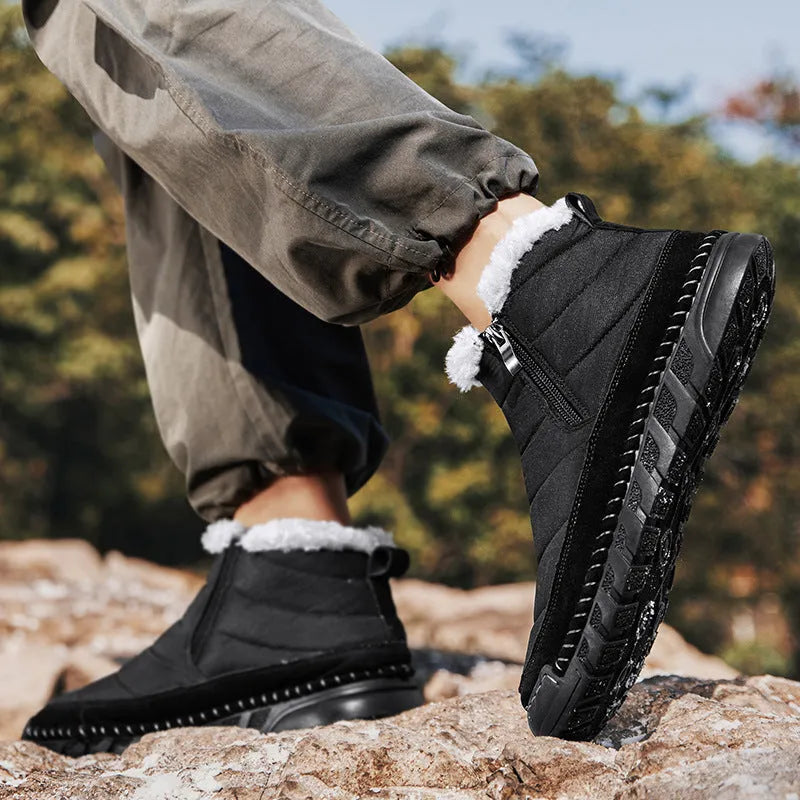 Men's plus size solid colour snow boot with round toe and flat heel on a non-slip rubber sole.