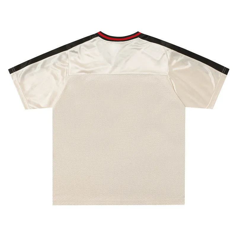 Apricot sports top with V-neck, short sleeves, printed letter pattern, and drop-shoulder design