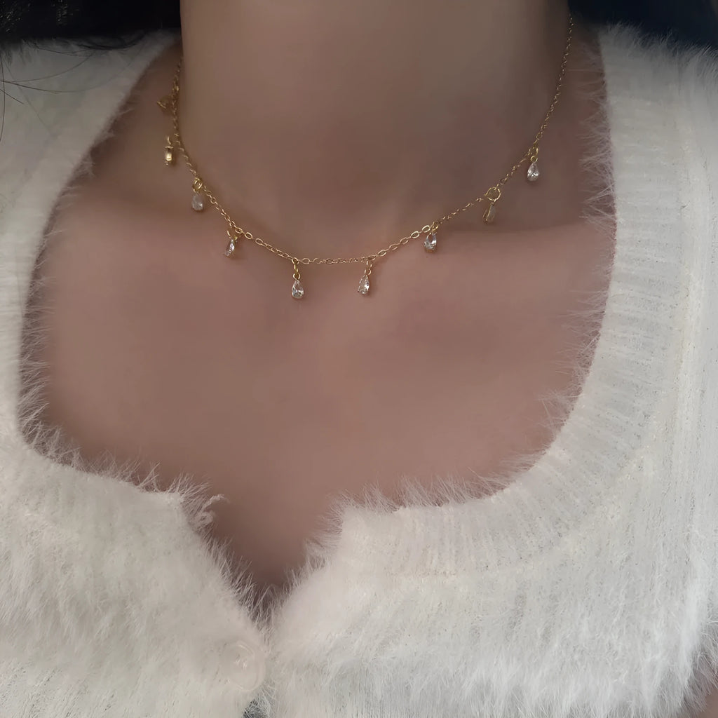 Geometric zircon necklace, earrings, and anklet set in a Korean-style meteor shower design.