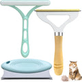 Three-piece pet hair remover set with metal, silicone, and round cleaning tools on a wooden table.