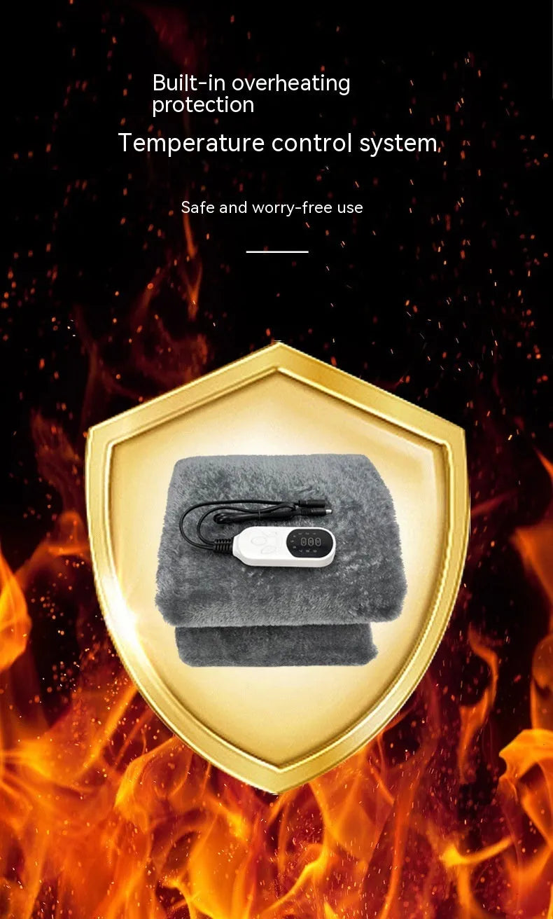 Grey 12V car electric blanket showing cigarette lighter plug connection and temperature controls