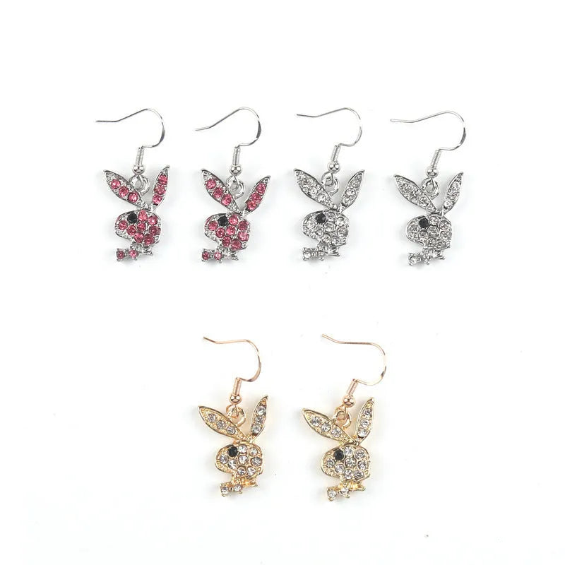 Pair of rabbit-shaped stud earrings with diamond accents on a silver background, showing front and back with butterfly clutch.