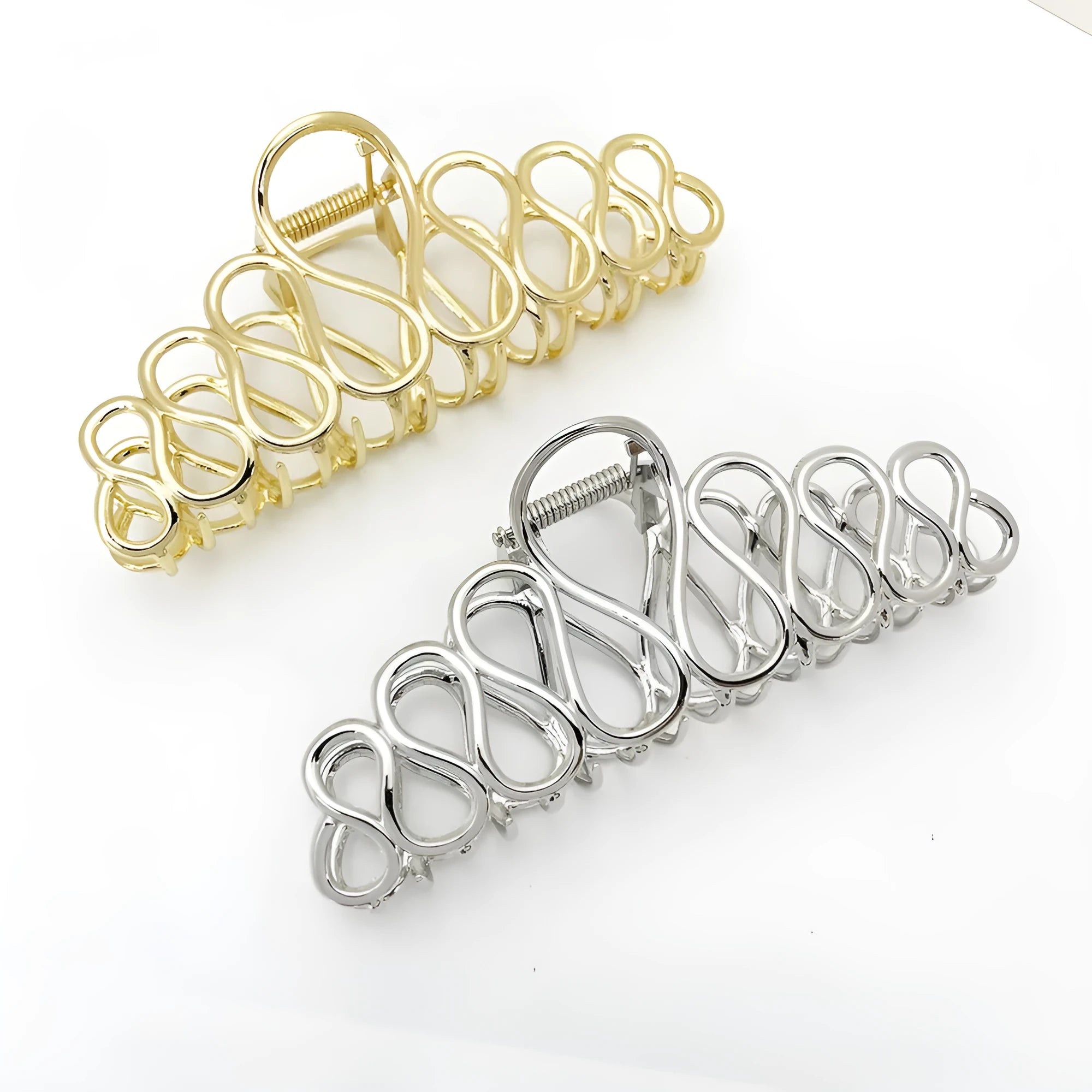 Minimalist large hair clip with gold electroplated finish and tassel detail on irregular geometric alloy design