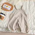 Unisex corduroy suspender overalls in creamy-white or brown plaid, with large pockets and double-breasted closure, for spring and autumn.