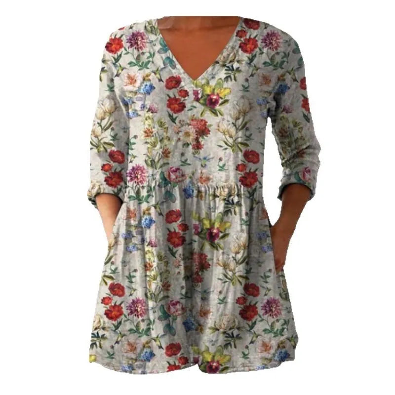 Women's printed loose dress with wide waist and three-quarter sleeves in a wave pattern.