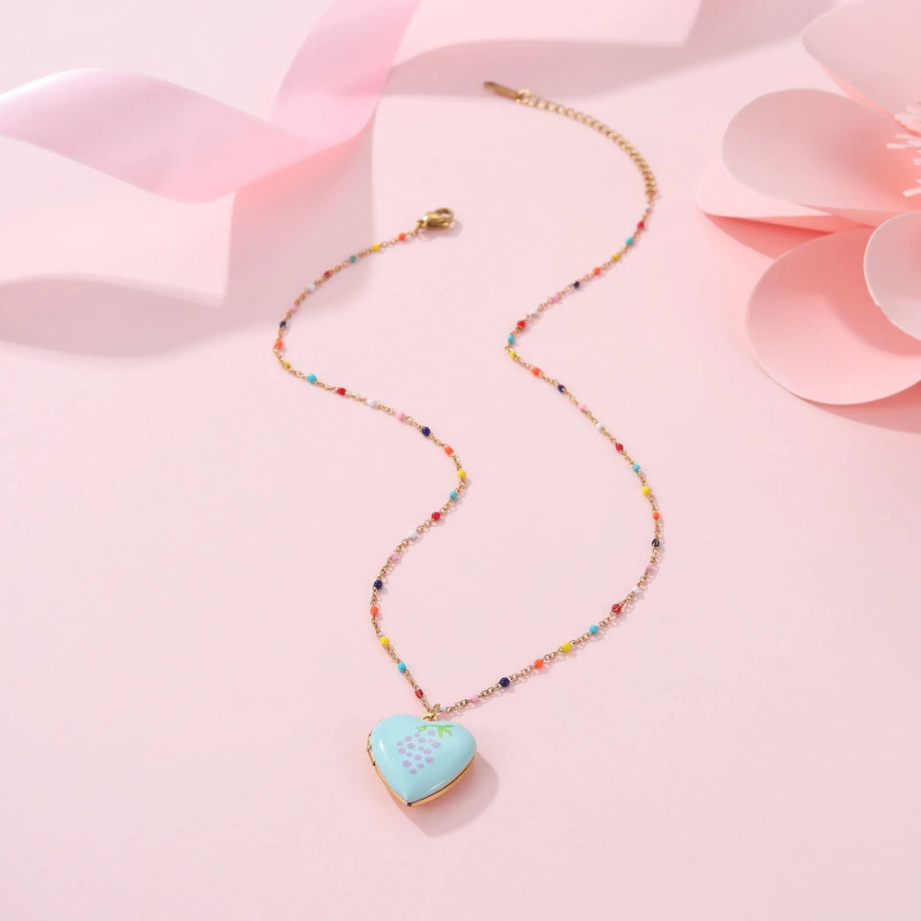 Gold-plated stainless steel necklace with a detailed strawberry-shaped pendant on a chain.