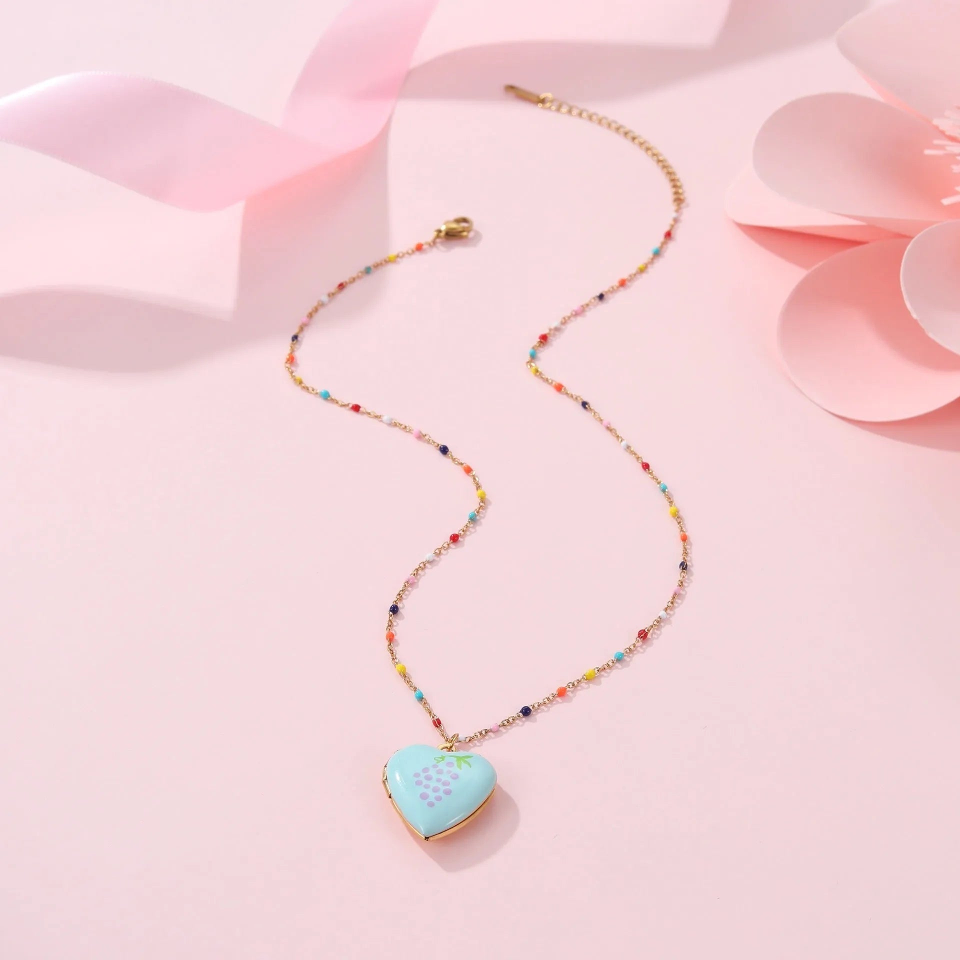 Gold-plated stainless steel necklace with a detailed strawberry-shaped pendant on a chain.