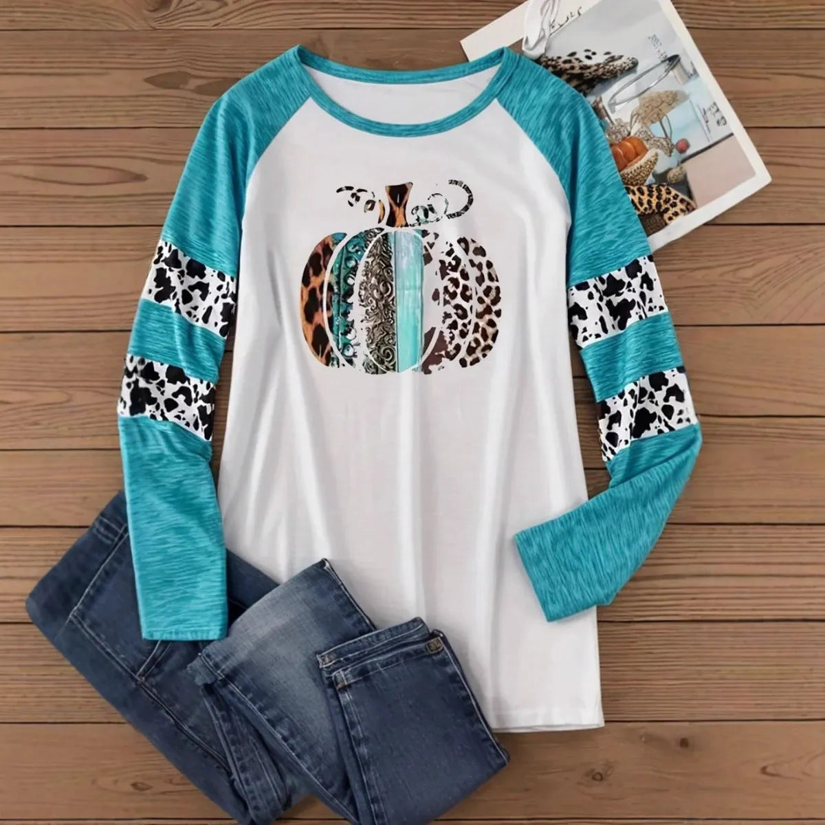 White long sleeve casual T-shirt with a sky blue Halloween pumpkin digital print design.