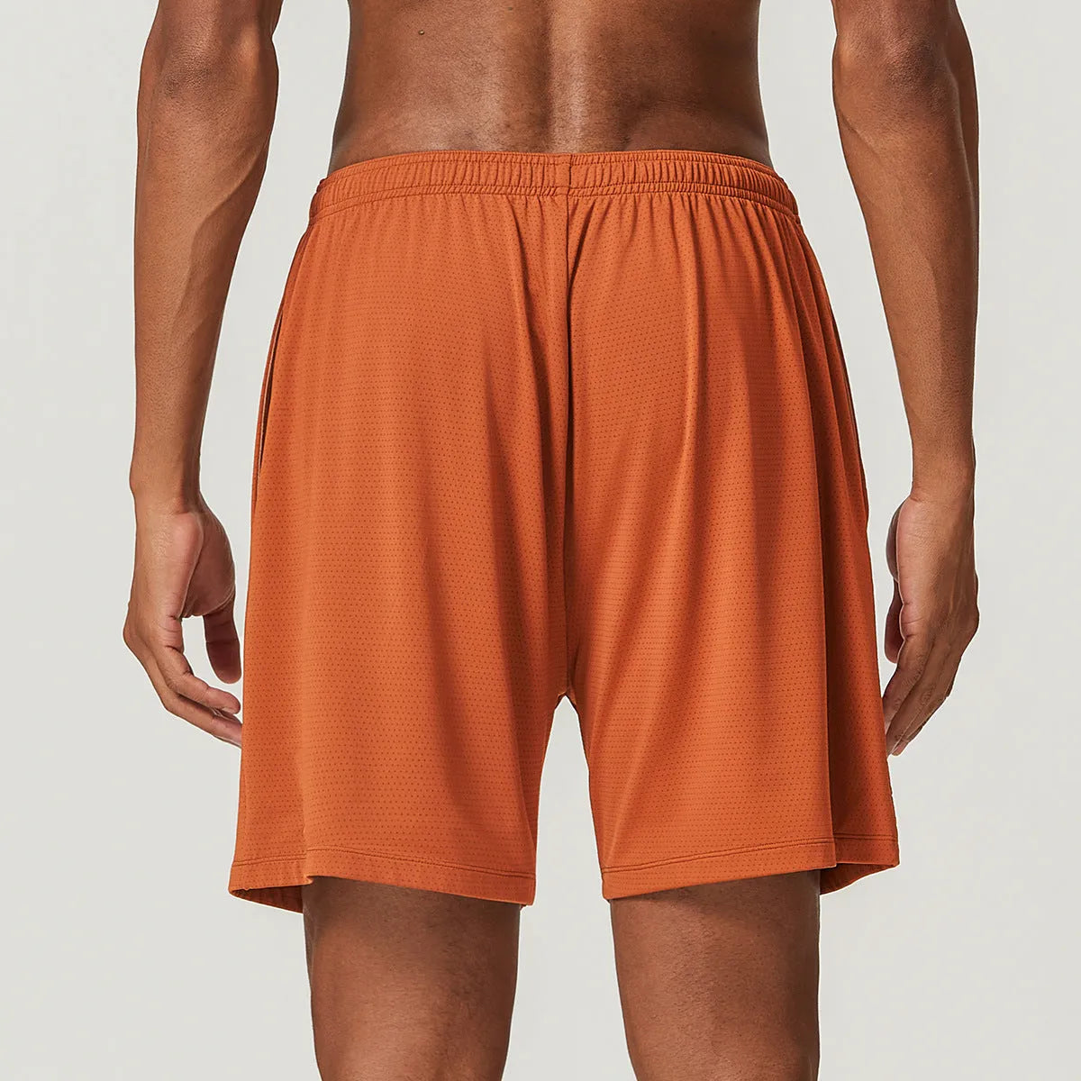 Men's sky blue double-layer running shorts with mid-waist fit and inner lining laid flat.