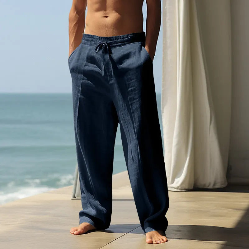 Men's loose cotton casual trousers in solid colours showing fit and fabric detail