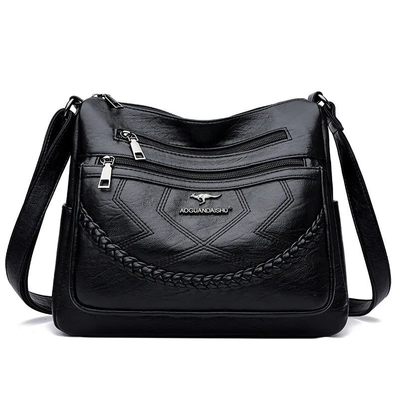 Soft black PU leather women's crossbody shoulder bag with a square shape on a white background.