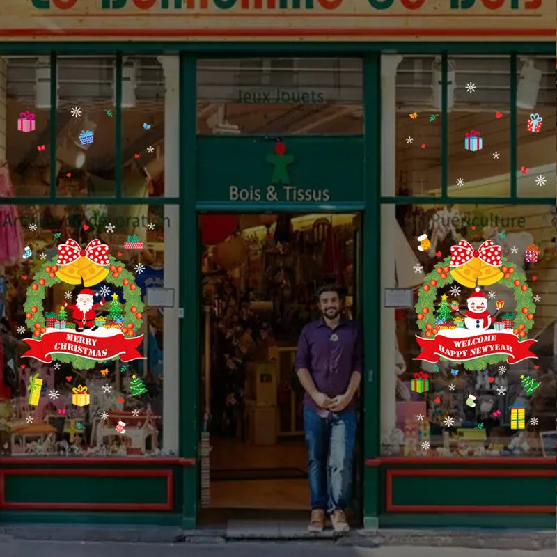 Two large colourful Christmas wall stickers with cartoon designs measuring 60cm by 45cm each for window decoration