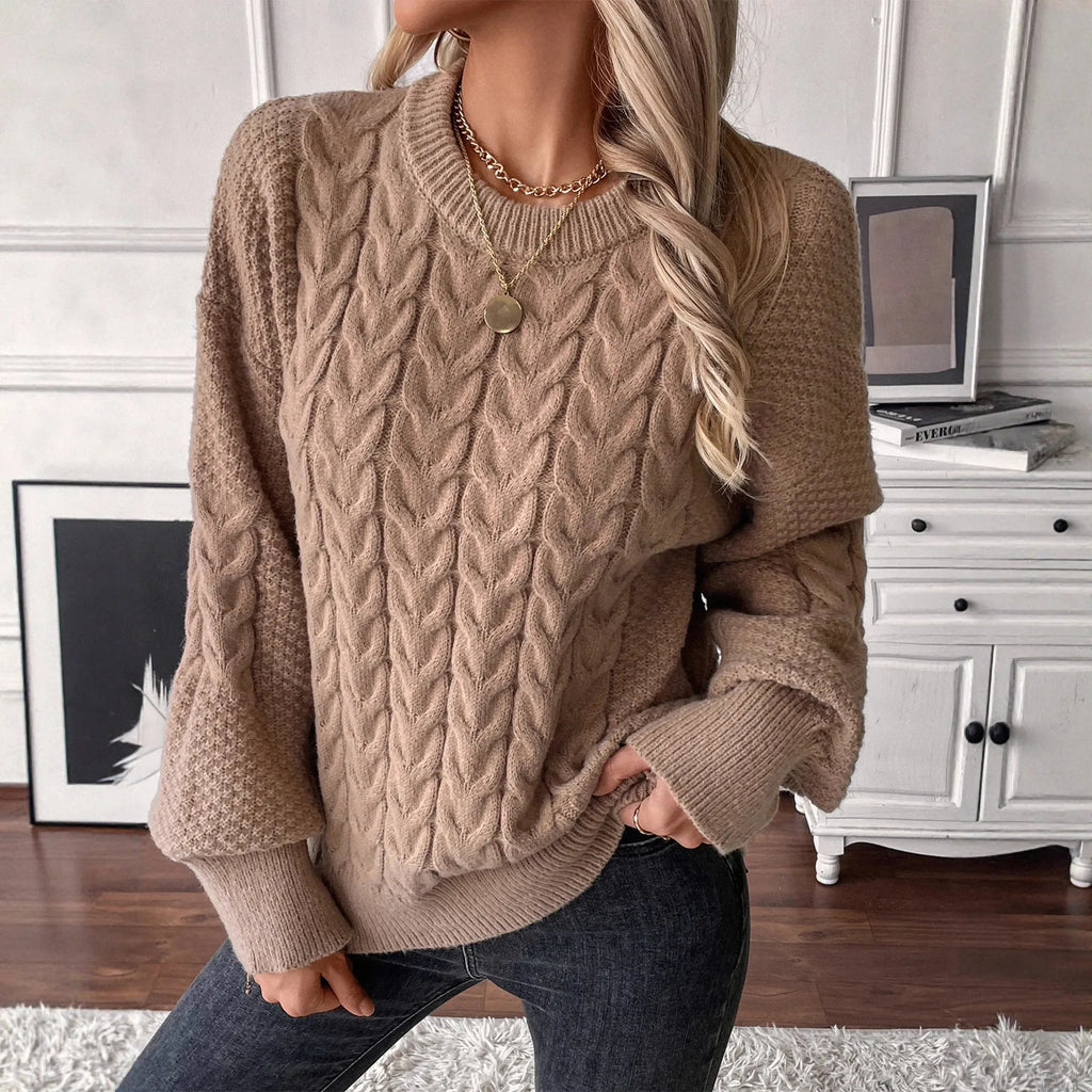 Beige women's loose casual sweater with a textured twist detail on the front.