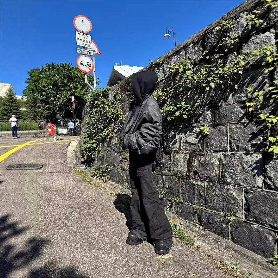 Black double-layer fake two-piece hooded pilot jacket with side seam pockets on a model
