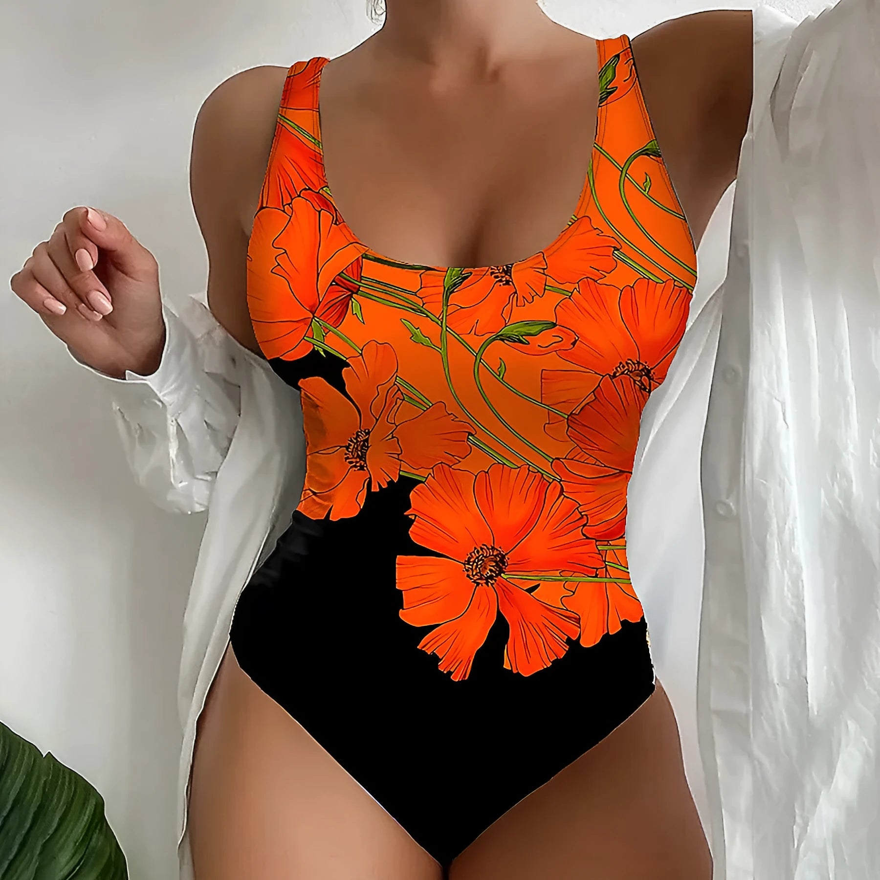 Orange floral print backless one-piece swimsuit with slim fit design on mannequin