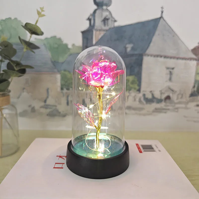 Glass cover small night lamp with plastic flowers in 15cm tall design with black base