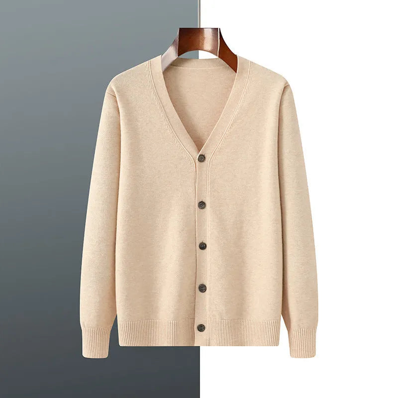 Man wearing a beige Andy velvet V-neck knitted cardigan coat with long sleeves.