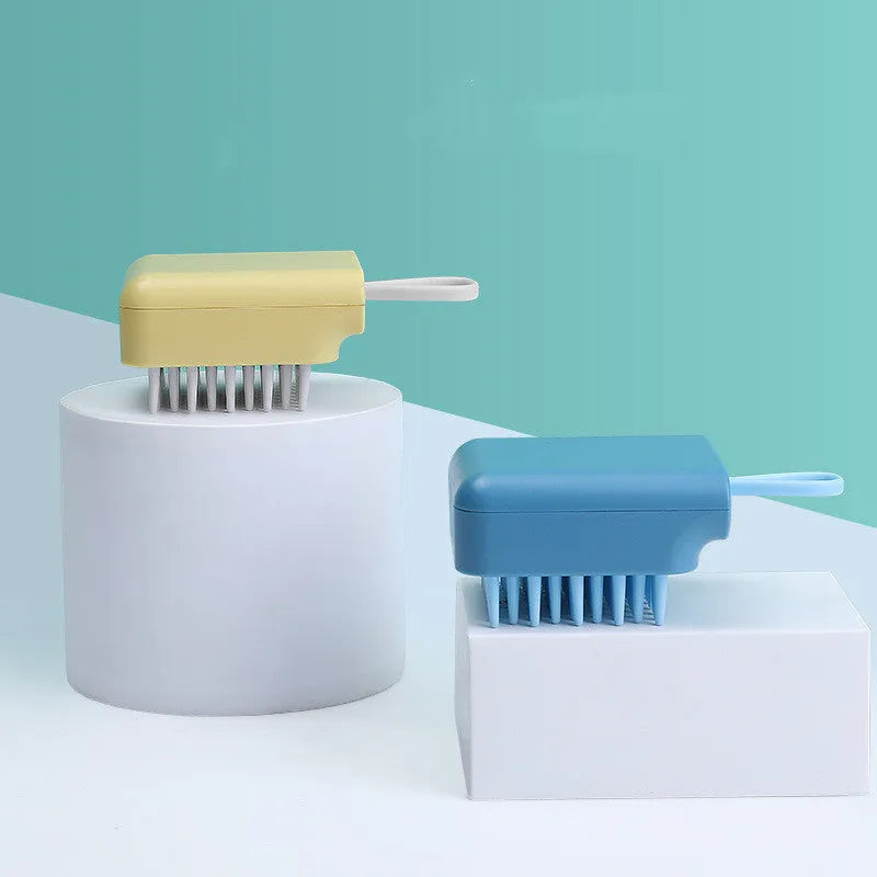 Pet bath brush with soft TPR combs for dog and cat grooming, available in blue, pink, white, and yellow.