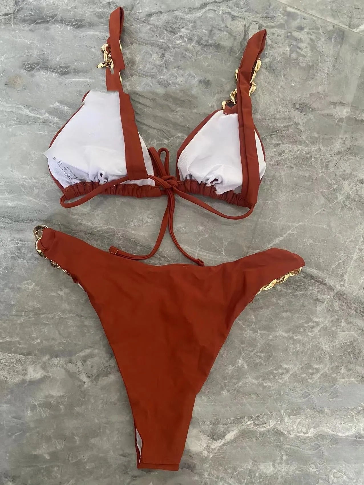 Brown strapless women's bikini with adjustable ring ties at the centre front and a classic split-leg bottom.