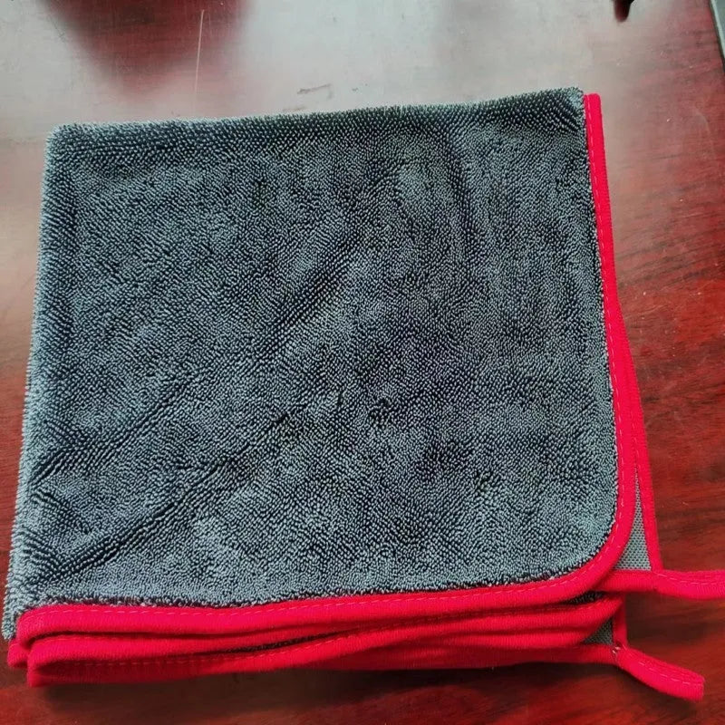 Grey twisted braid car cleaning cloth shown next to a smaller size option with red edge.