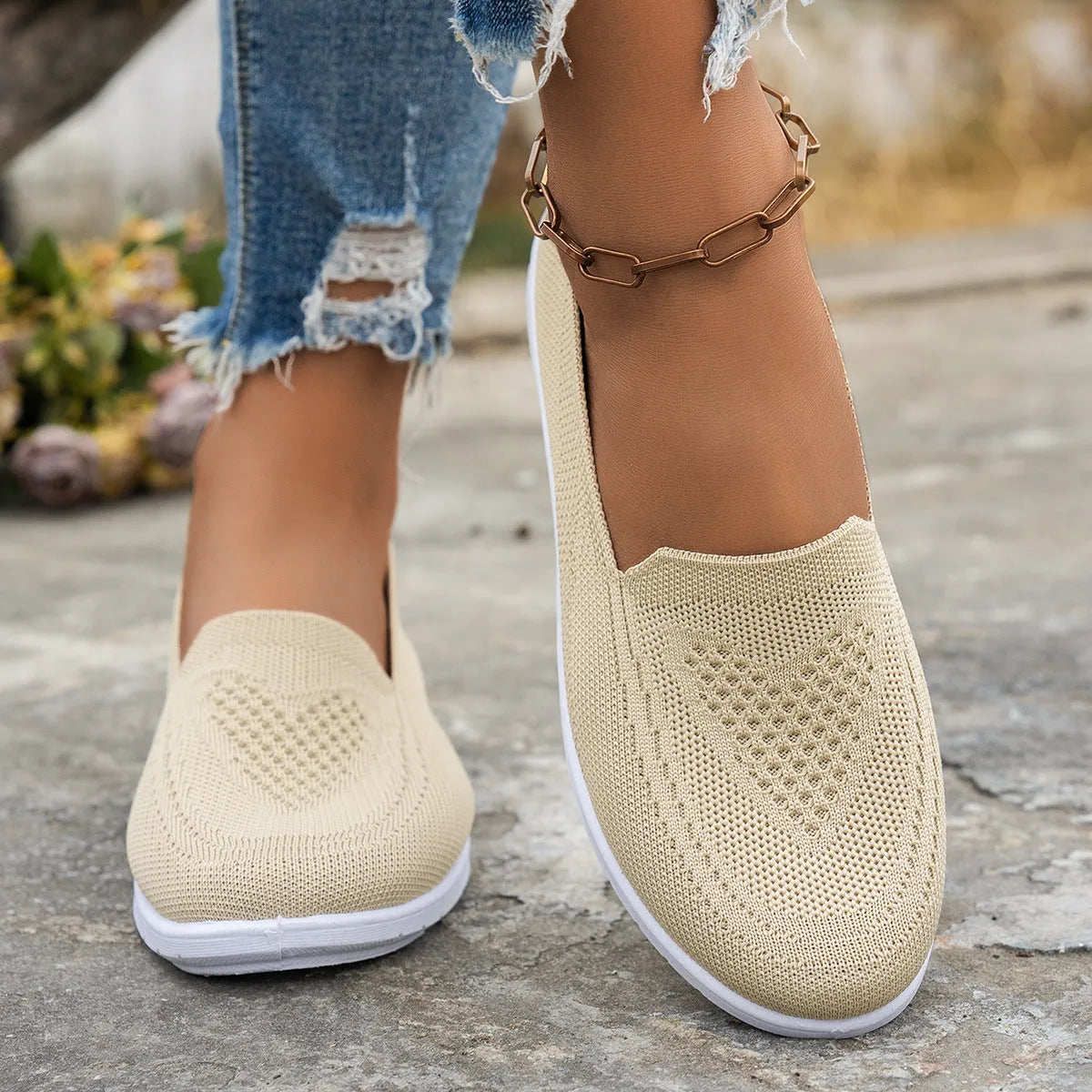 Women's mesh trainers with low flat heel and PVC sole, shown in a solid colour casual style