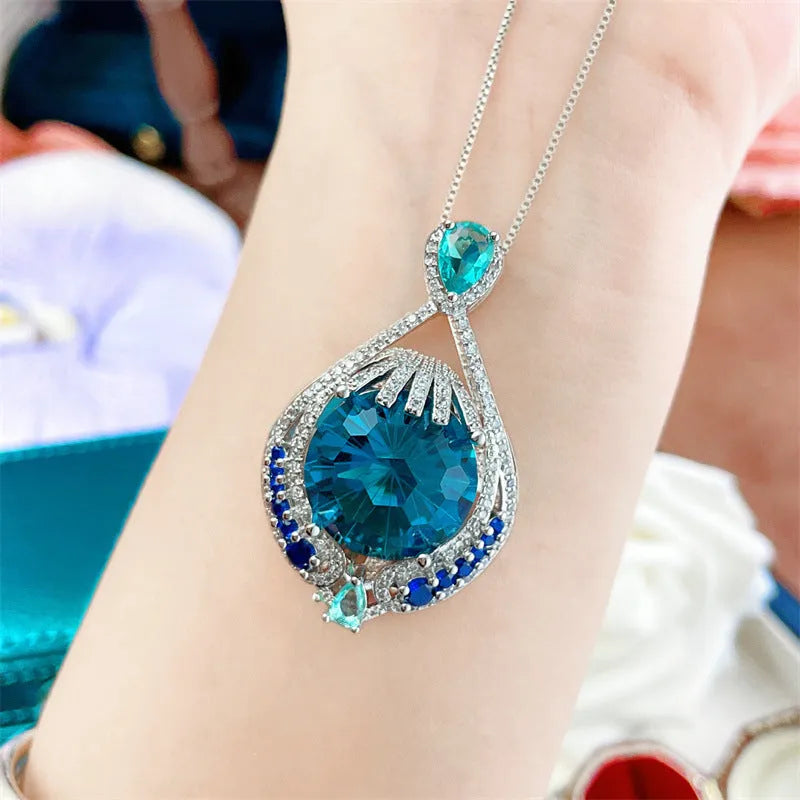 Blue fireworks-cut crystal geometric pendant necklace on water wave chain