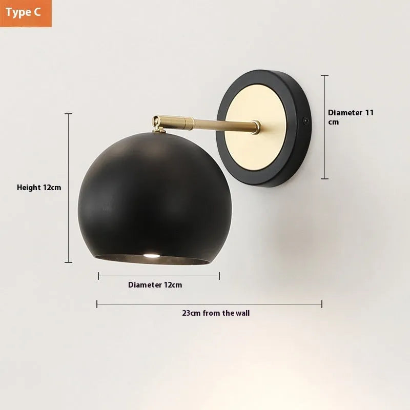 Nordic style iron wall lamp mounted on a wall beside a bed