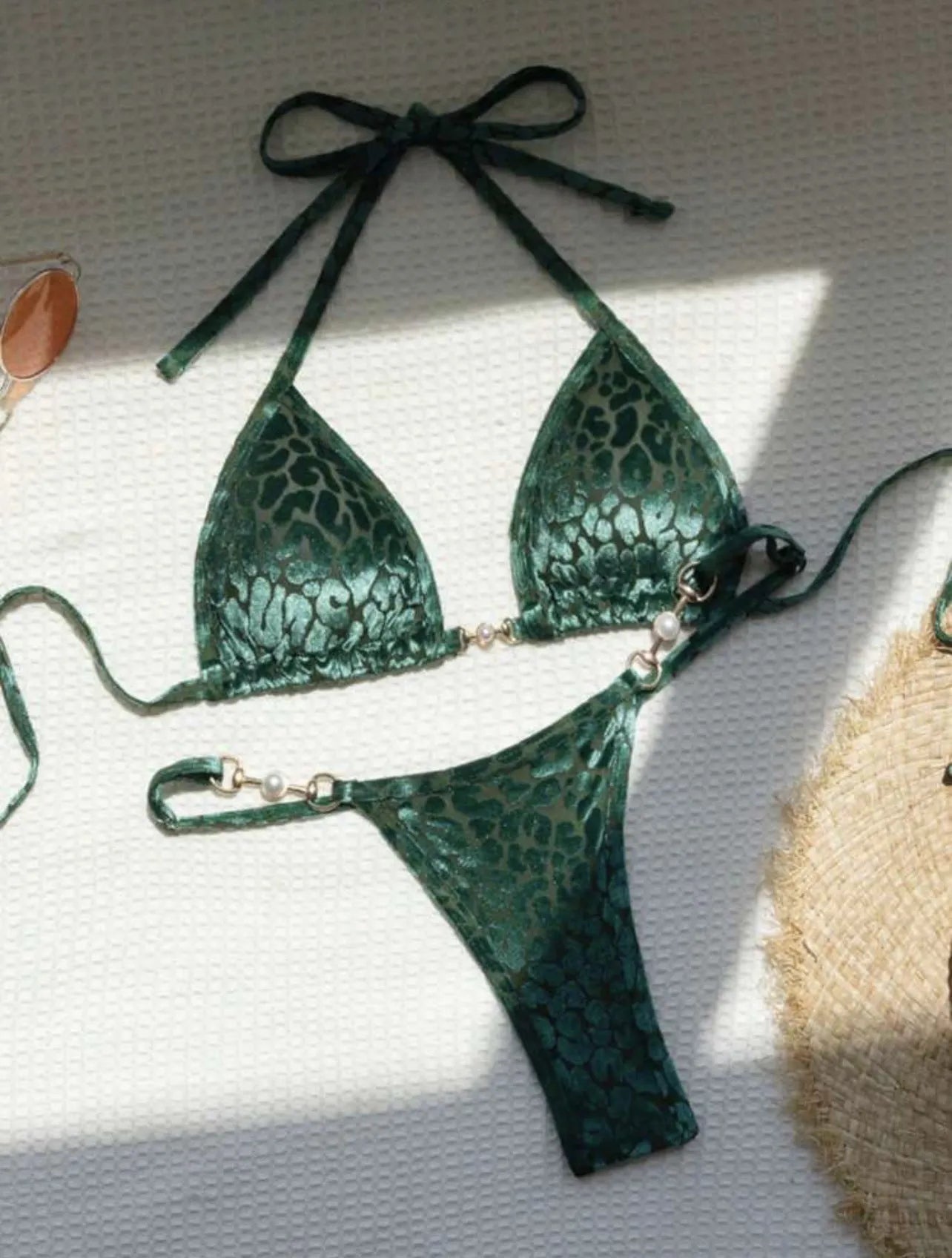 Women's blue leopard print T-shaped swimwear bikini set made from polyester and spandex fabric.