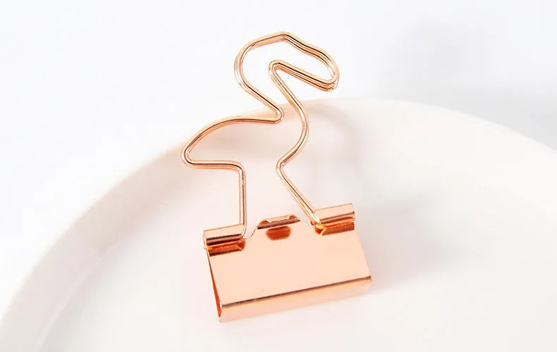 Gold metal paper clip with decorative shape options including bow, cactus, cat, flamingo, love, and clouds.