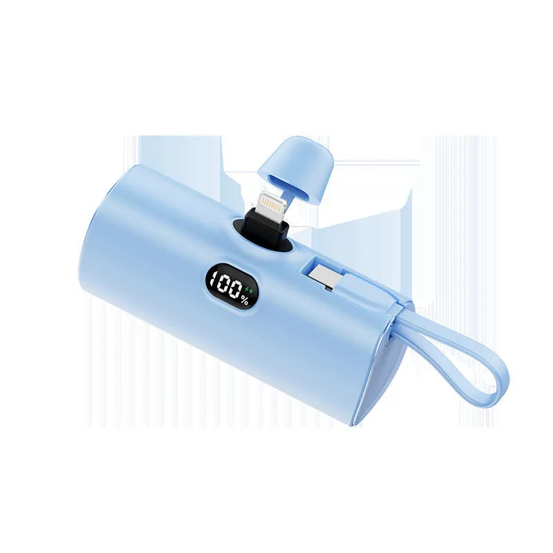 Compact rectangular power bank with digital screen, shown in blue colour, displaying battery percentage, with folding plug unfolded.