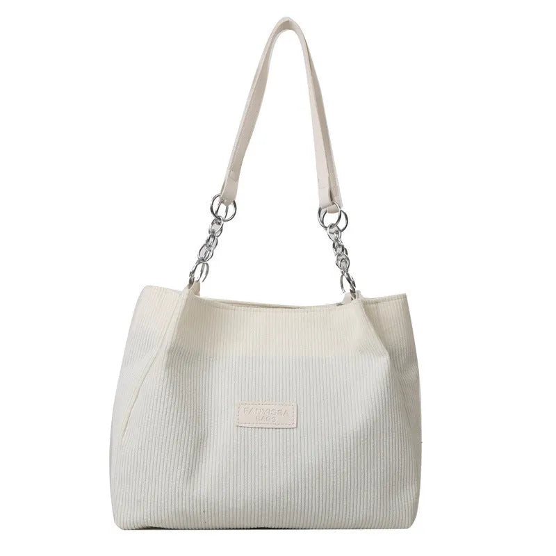 Corduroy one-shoulder tote handbag in black, brown, or white with horizontal square silhouette